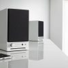 Audioengine HD3 Next Gen Wireless Desktop Speakers in White Lifestyle with phone