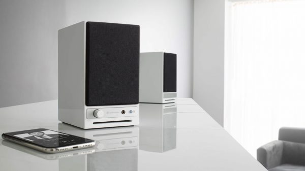 Audioengine HD3 Next Gen Wireless Desktop Speakers in White Lifestyle with phone