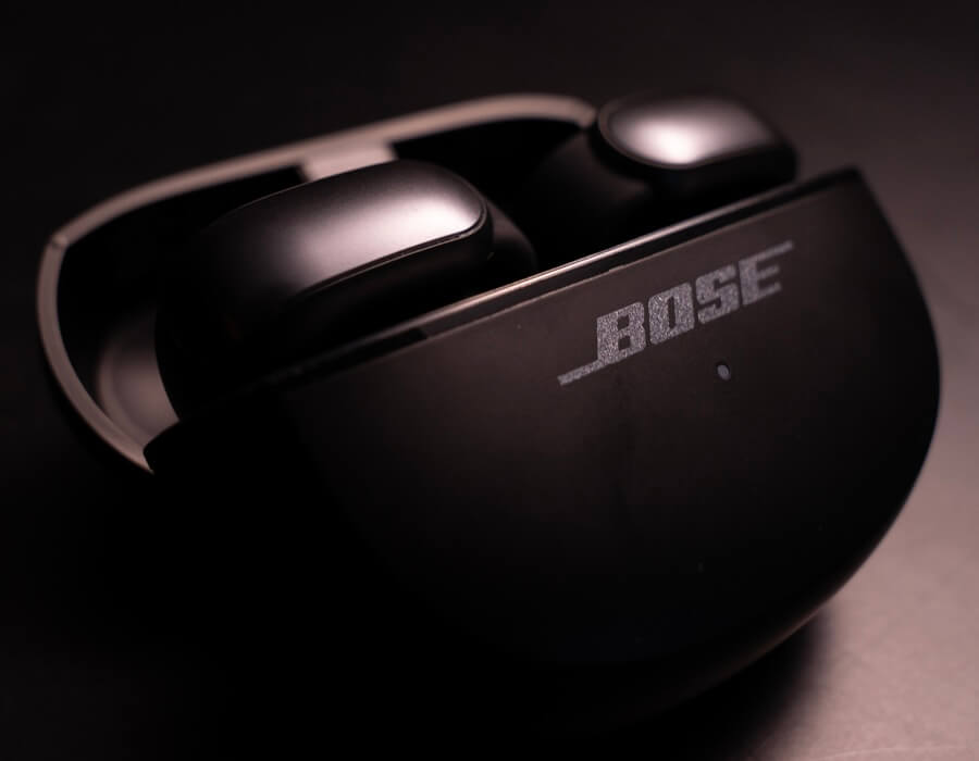 Bose Ultra Open Earbuds inside charging case in black