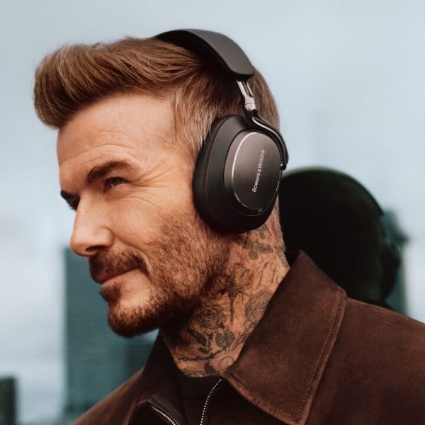 David Beckham wearing black Bowers & Wilkins Px8 S2 wireless headphones