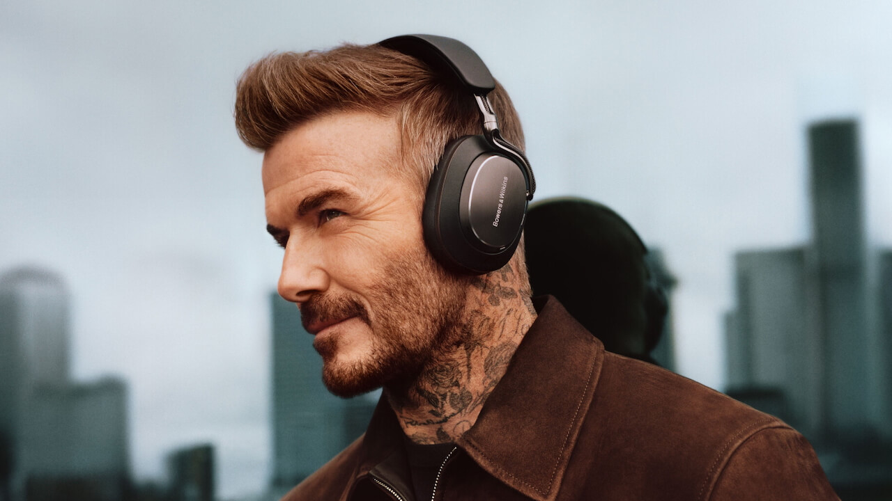 David Beckham wearing black Bowers & Wilkins Px8 S2 wireless headphones