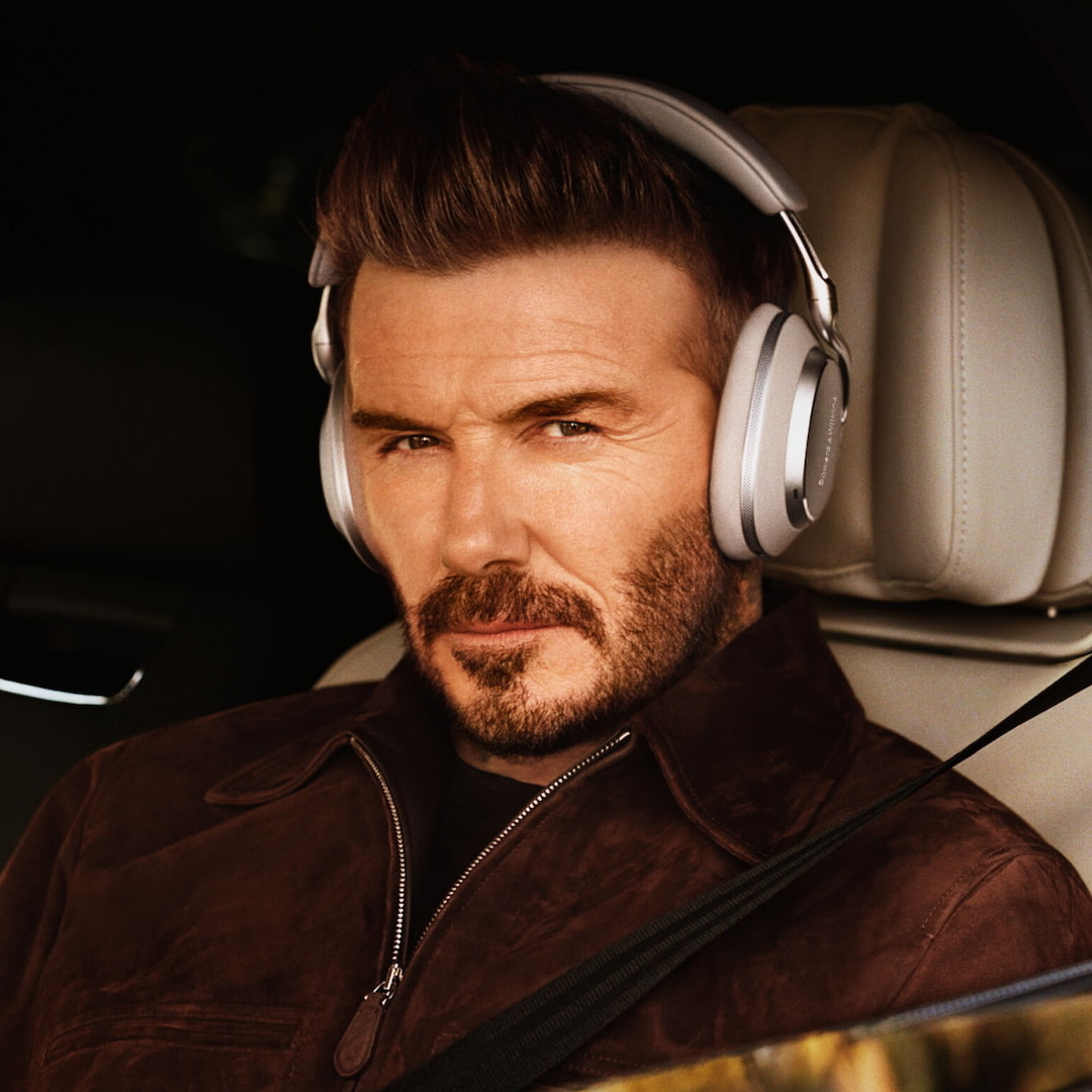 David Beckham wearing Bowers & Wilkins Px8 S2 Wireless Headphones in warm stone color
