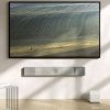 KEF XIO Soundbar in Silver Grey mounted on-wall