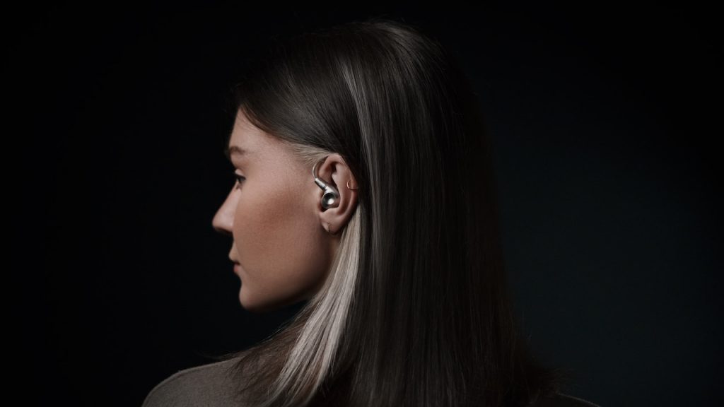 Woman wearing Meze Audio Astru IEM in-ear