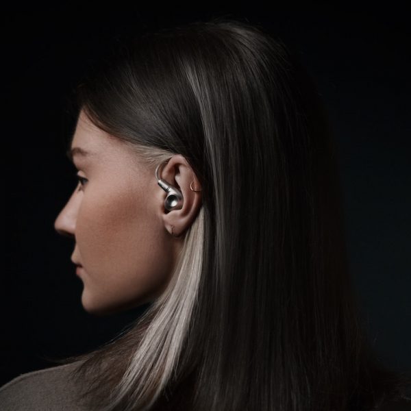Woman wearing Meze Audio Astru IEM in-ear