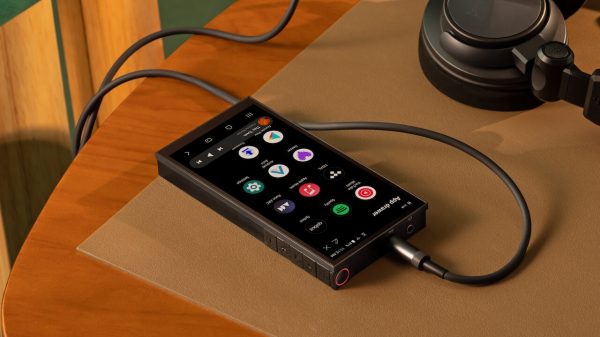 Astell&Kern PD10 Black DAP on table with headphones