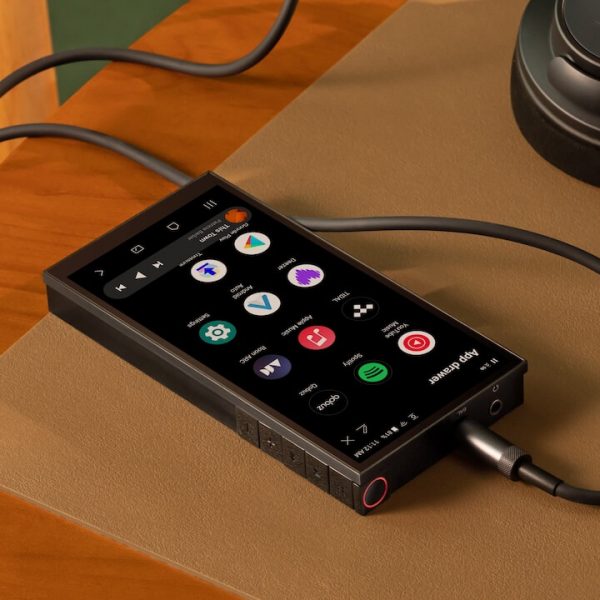 Astell&Kern PD10 Black DAP on table with headphones