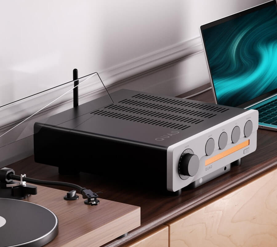 Quad 3 Integrated Amplifier Angle Lifestyle Between Turntable and MacBook