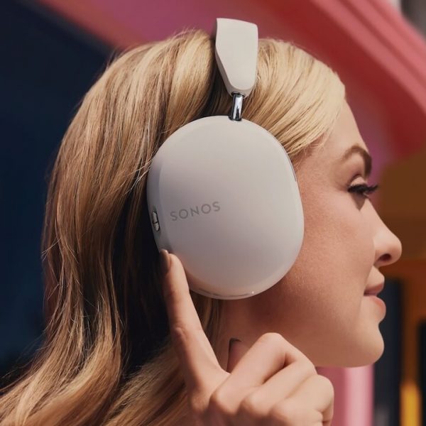 Woman wearing Sonos Ace Headphones in White