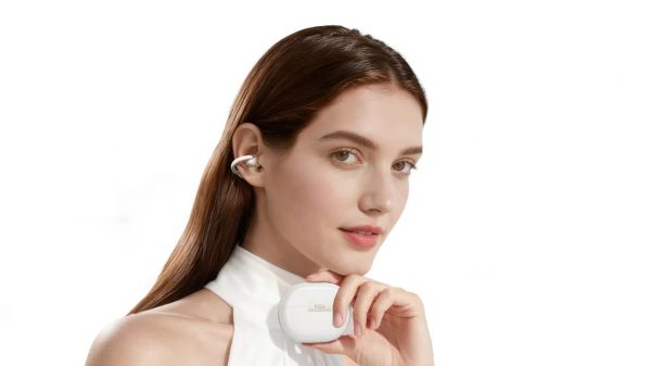 TCL CrystalClip Open-ear Wireless Earbuds Lifestyle Woman Holding White Charging Case